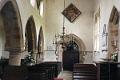 13. Interior of church - note hatchment with black backgound denoting death of the bearer of the heraldic arms
